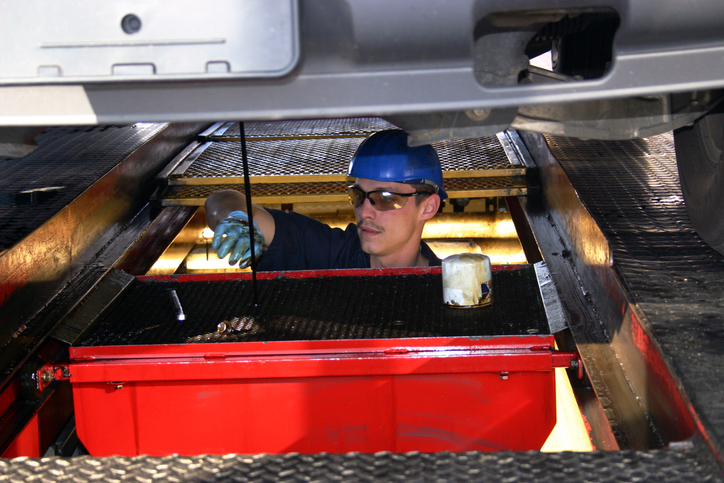 EHS-Oil-change-mechanic-under-car